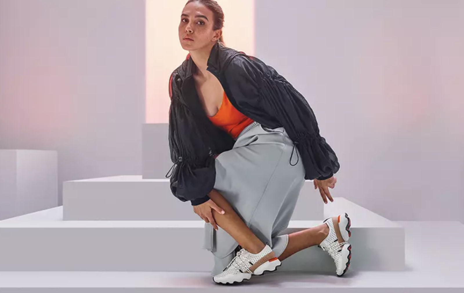 Woman posing in Sorel sneakers