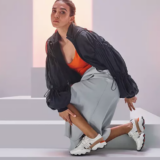 Woman posing in Sorel sneakers