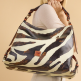 Dooney & Bourke History, Ownership & Stores