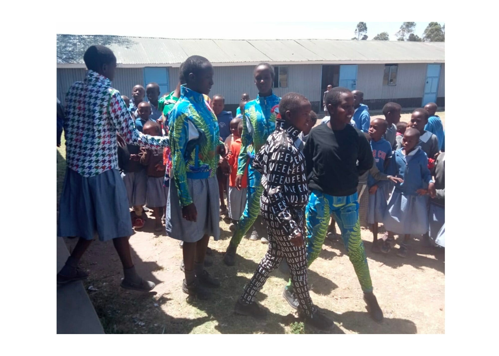 Children of Kenya, Africa dressed in Sassy Jones Ready to Wear collections.