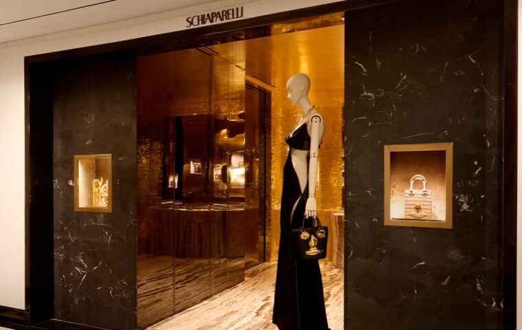 Schiaparelli’s Redesigned Bergdorf Goodman Salon Turns The Fourth Floor Into a Sculptural Space of Beveled Mirrors Lacquered Wood and Satin Steel Fireplace