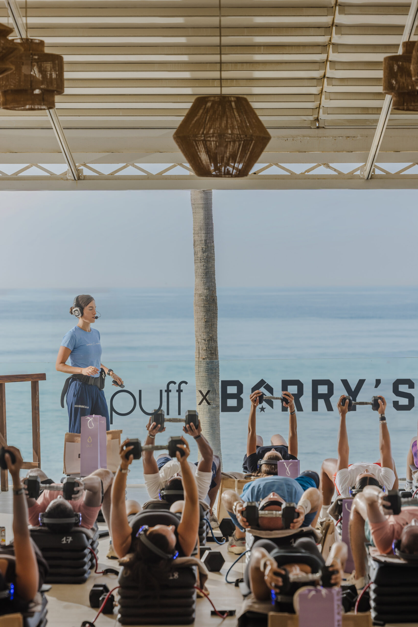 Participants at the PUFF and Barry’s beachside fitness activation in Marbella