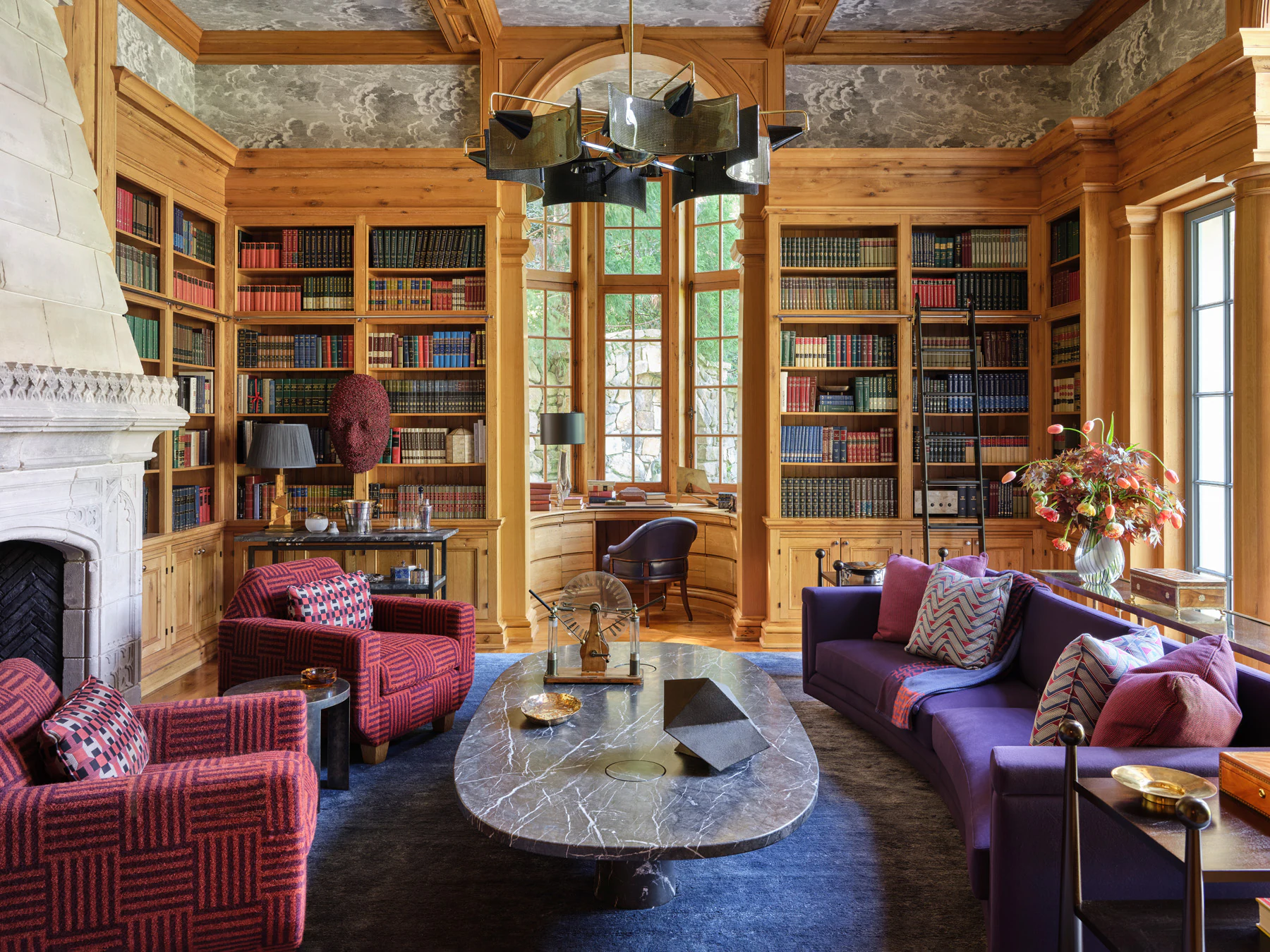 Jewel-toned pine-paneled library by Summer Thornton Design.