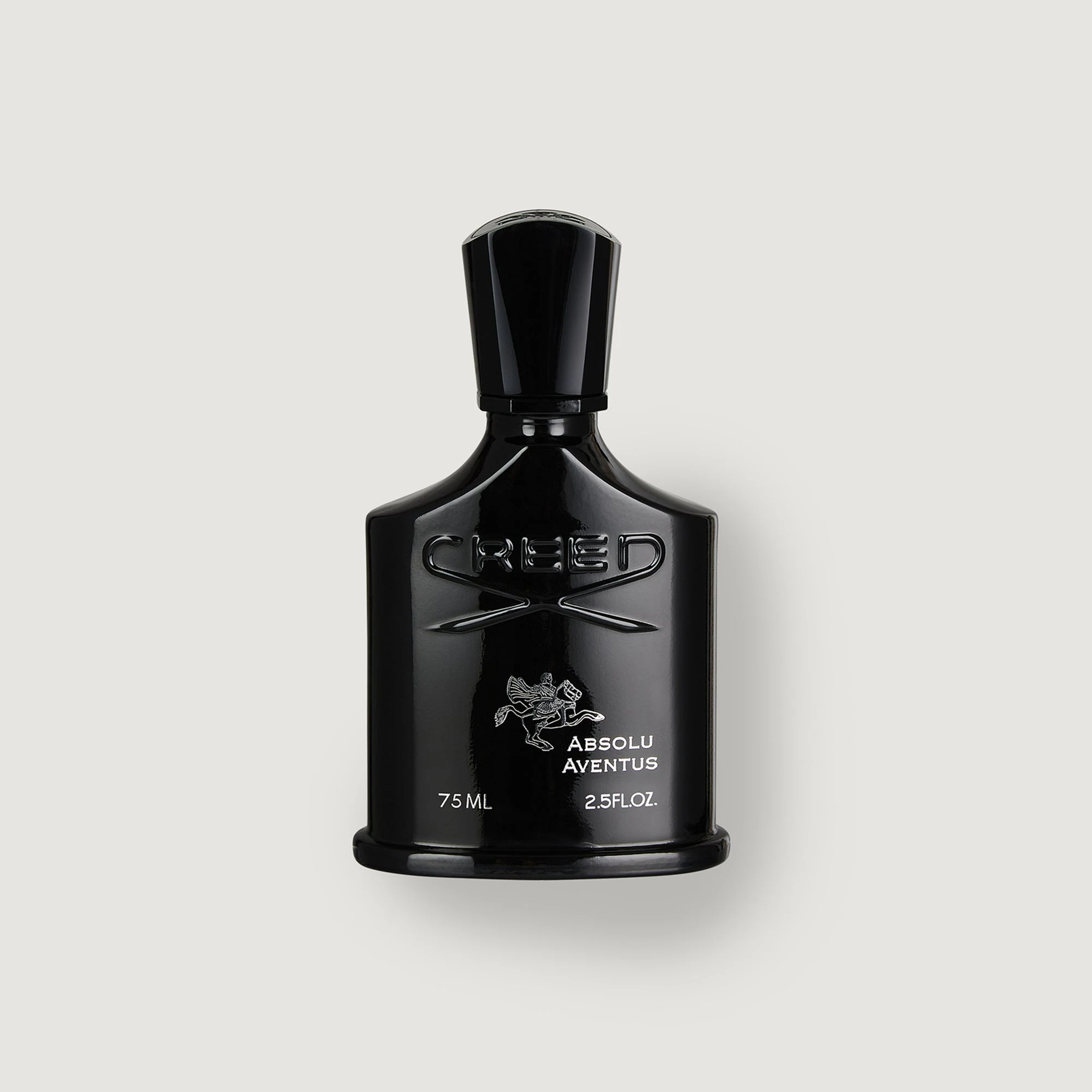 Creed Absolu Aventus bottle with citrus on a dark campaign background.