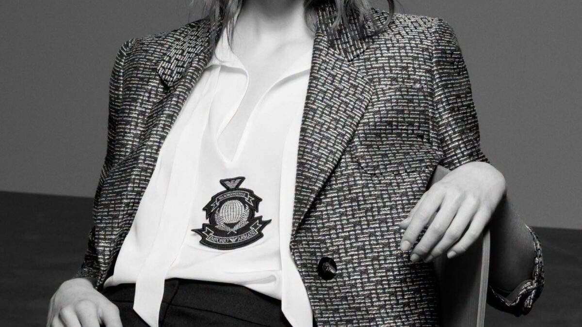 Model wearing Emporio Armani houndstooth blazer with crest emblem from the Fall-Winter 2026-27 collection