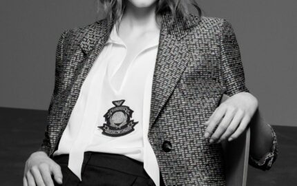 Model wearing Emporio Armani houndstooth blazer with crest emblem from the Fall-Winter 2026-27 collection