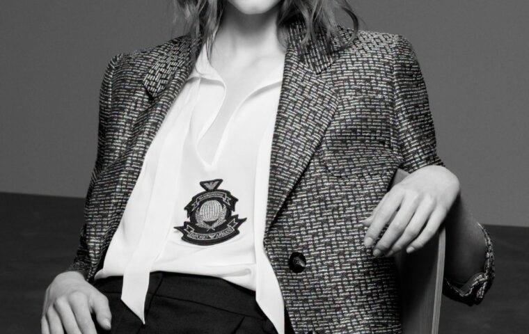 Model wearing Emporio Armani houndstooth blazer with crest emblem from the Fall-Winter 2026-27 collection