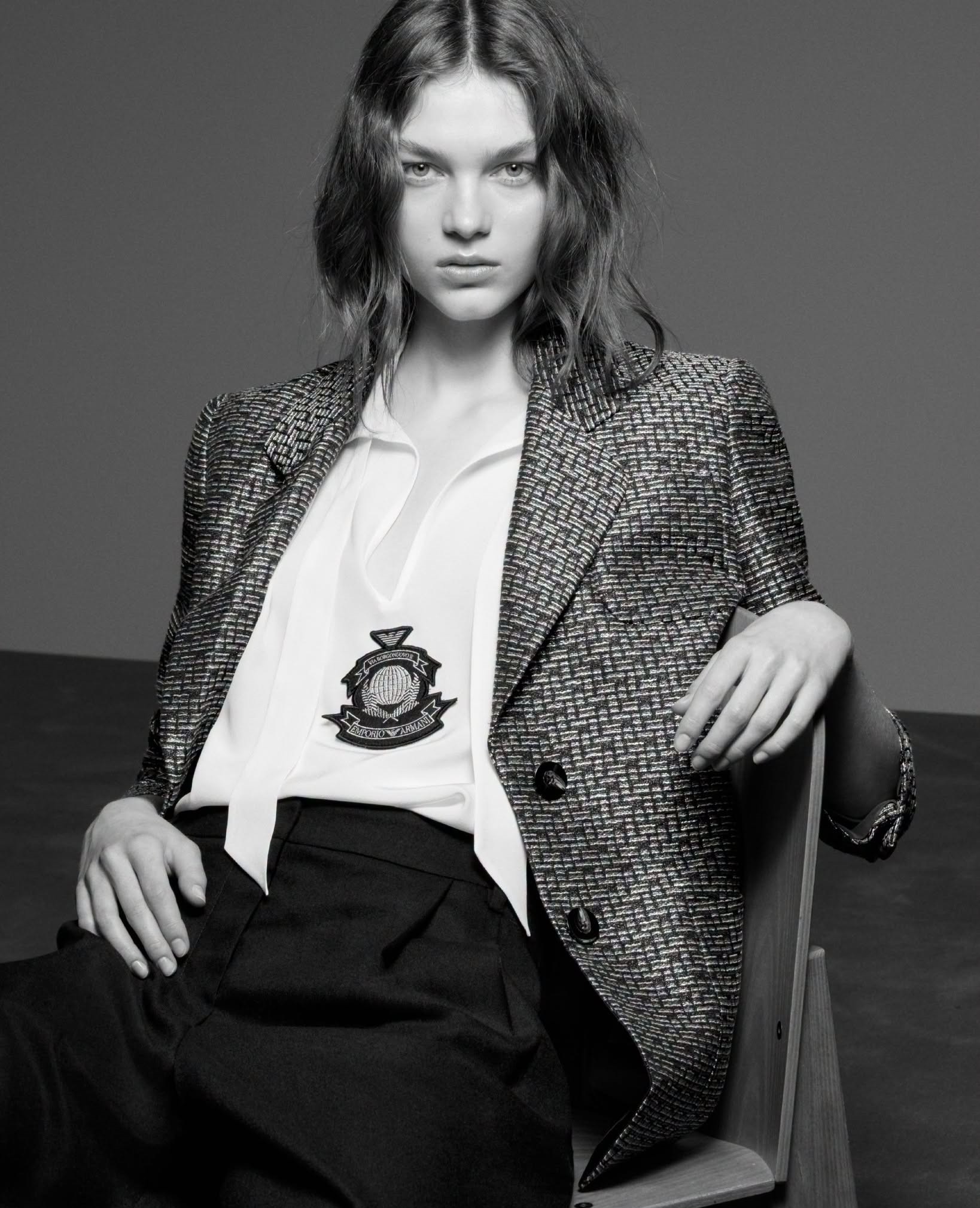 Model wearing Emporio Armani houndstooth blazer with crest emblem from the Fall-Winter 2026-27 collection