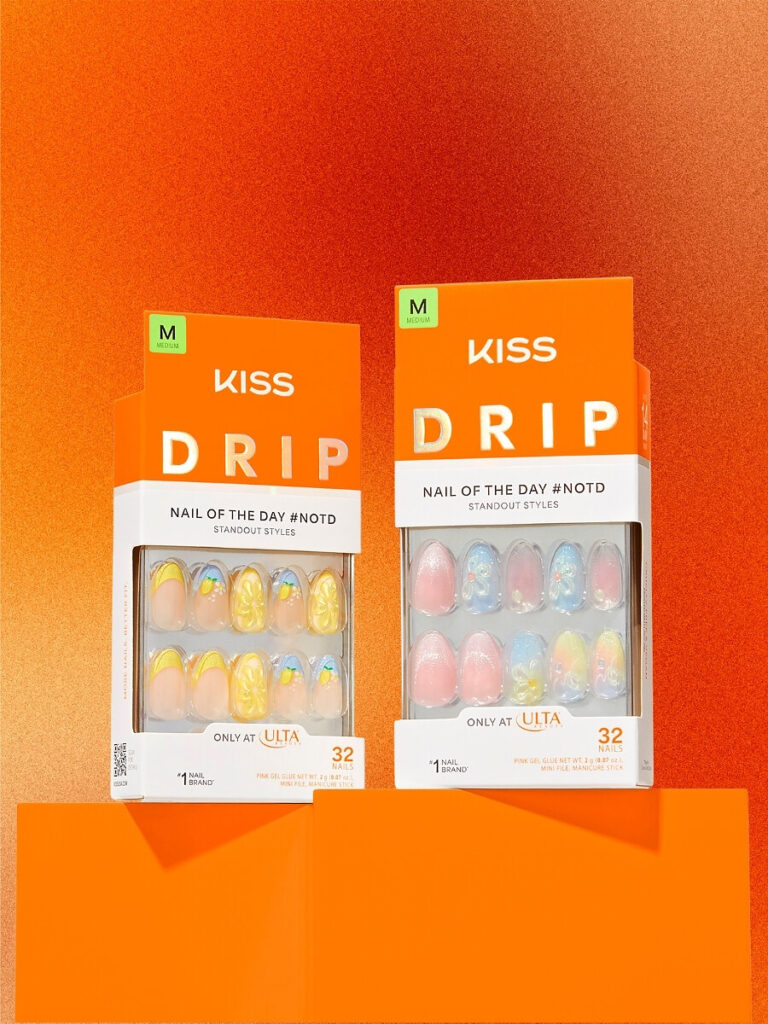 KISS Drip nail product packages against an orange backdrop