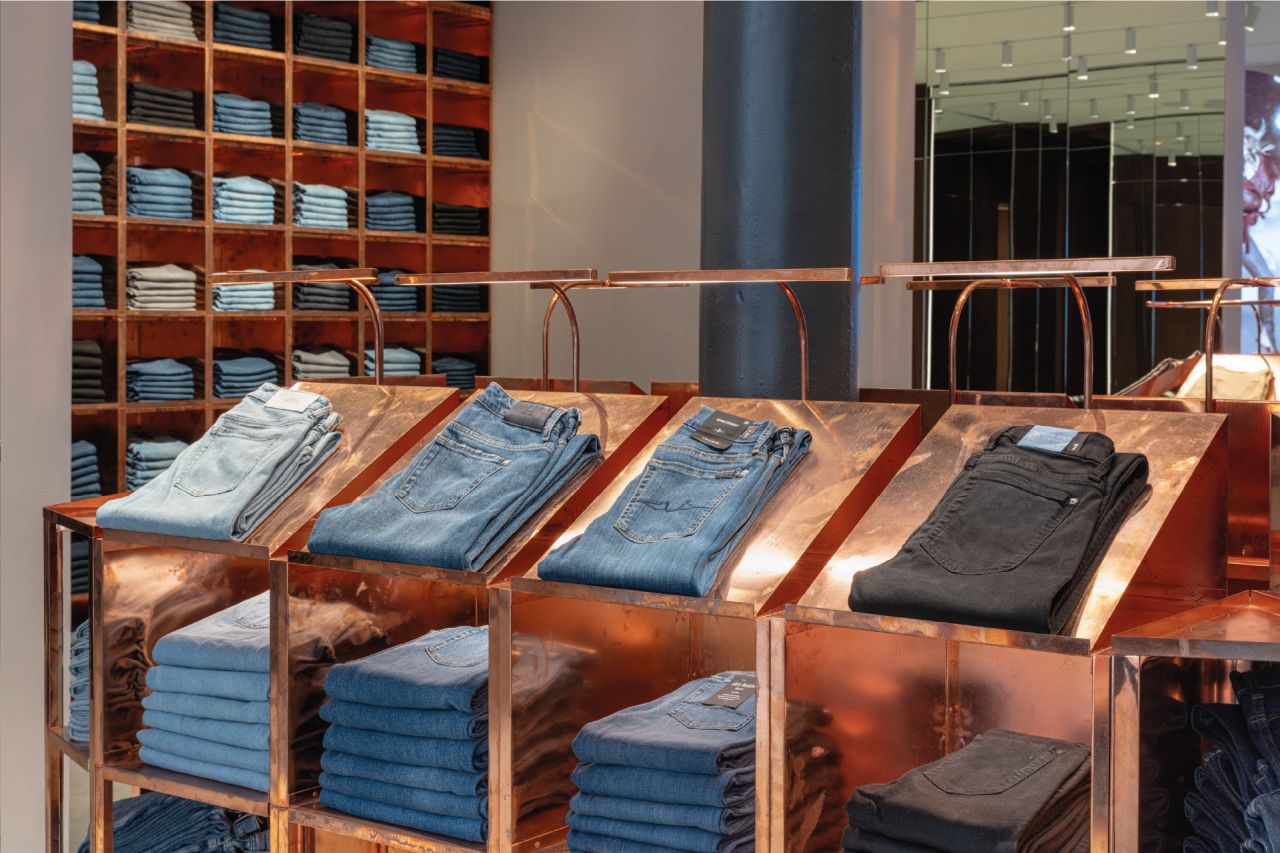 Interior of the reopened 7 For All Mankind SoHo flagship, view 3