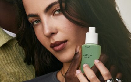 Model holding PHLUR Matcha Milk hair and body fragrance mist