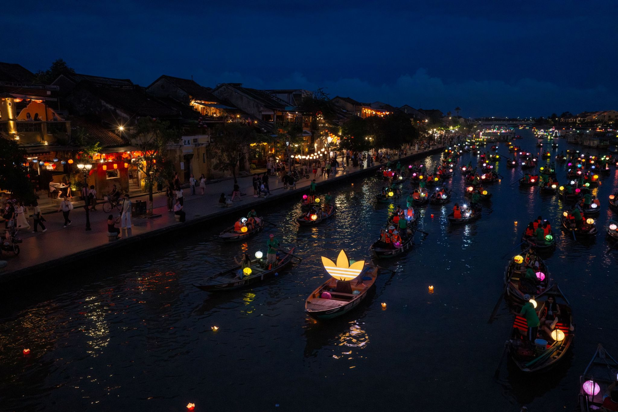 adidas Trefoil boat in the Hoai River during the Hoi An store opening