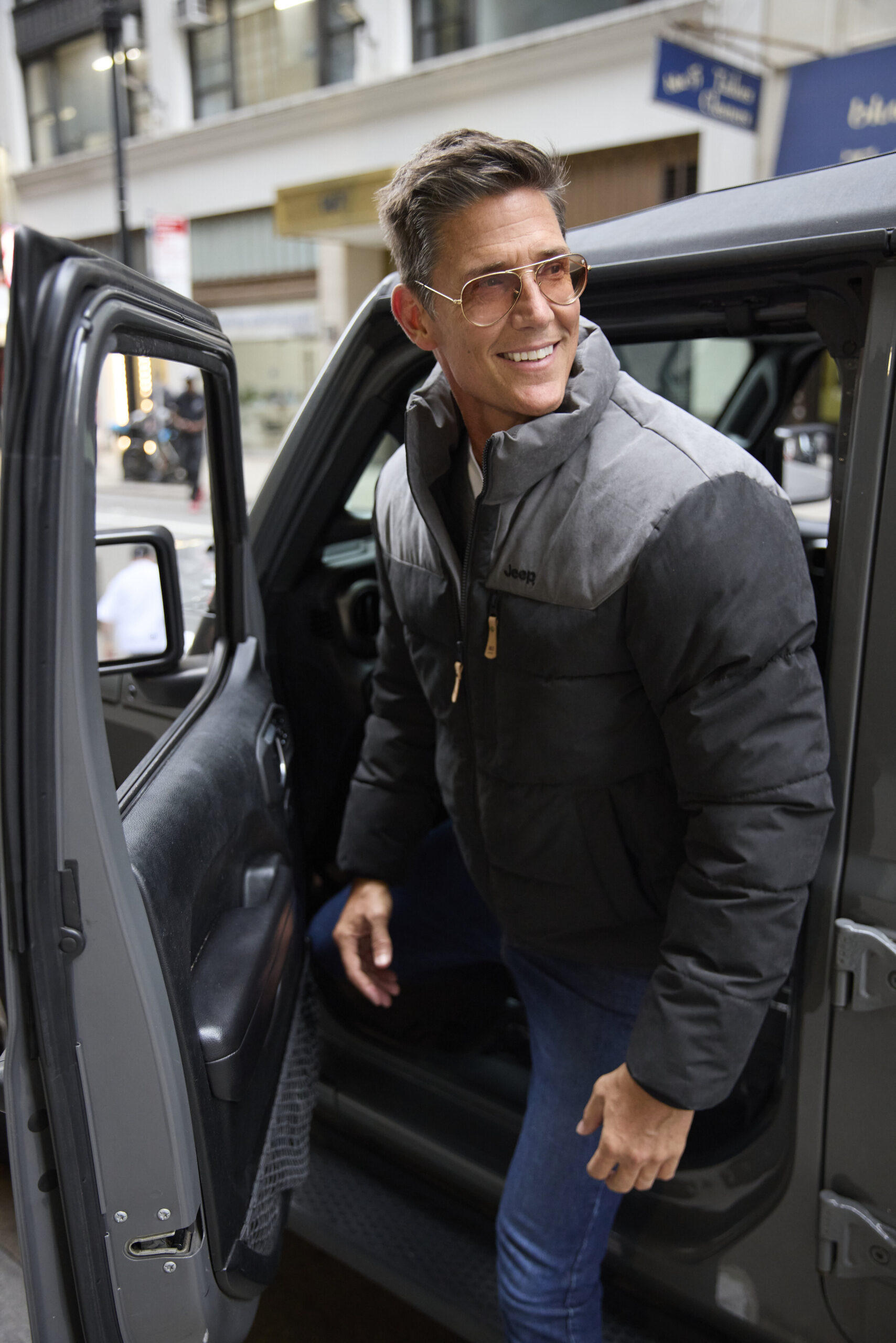 Model wearing men’s Jeep outerwear from Amerex.