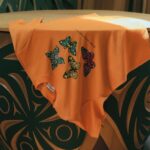 Orange Every Child Matters T-shirt featuring Susan Point’s butterfly artwork