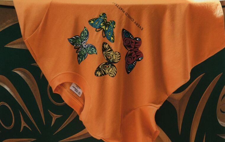 Orange Every Child Matters T-shirt featuring Susan Point’s butterfly artwork