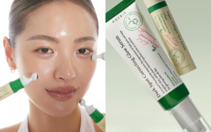 AXIS-Y brand imagery showing a model applying skincare alongside serum packaging.