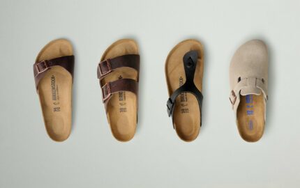 Four classic Birkenstock sandals photographed from above, showing their contoured footbeds