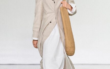 Bottega Veneta Summer 2027 runway look with light tailoring and woven bag