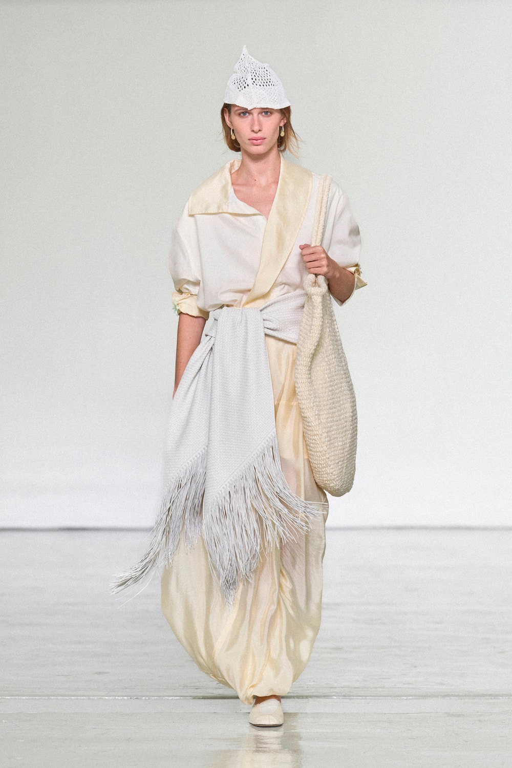 Bottega Veneta Summer 2027 runway look with fringed styling and woven bag