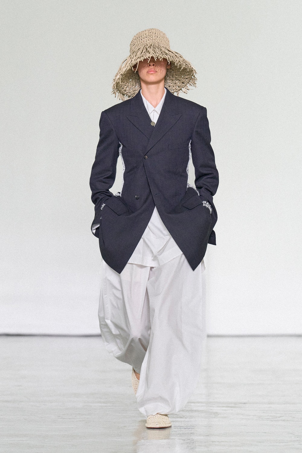 Bottega Veneta Summer 2027 dark tailored jacket and raffia hat