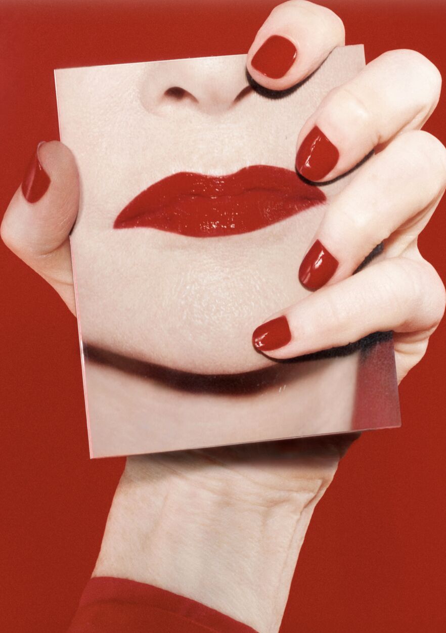 Red lip product and hand detail from Byredo’s Iconic Lips campaign