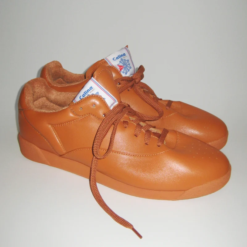 Pair of Peanut CELINE and Reebok Freestyle Lo sneakers