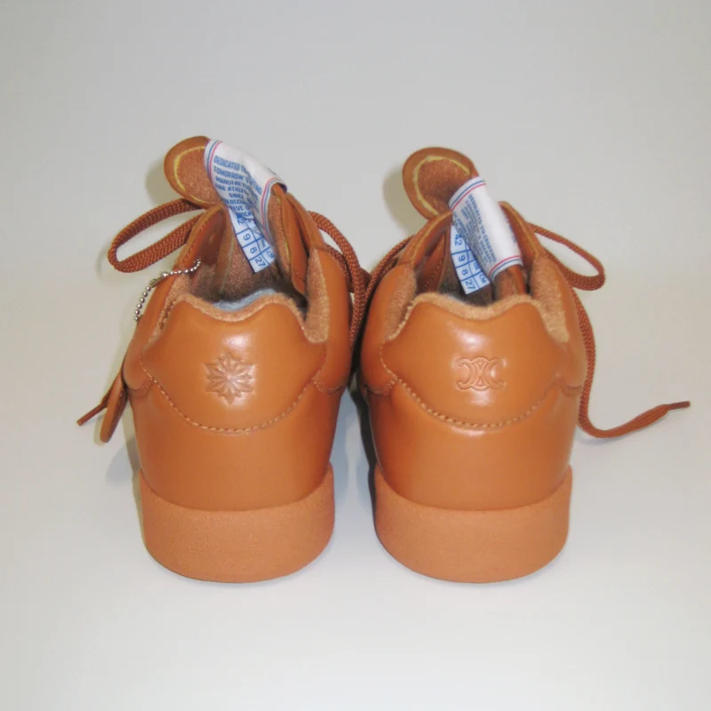 Reebok and CELINE Triomphe signatures on the sneaker heels