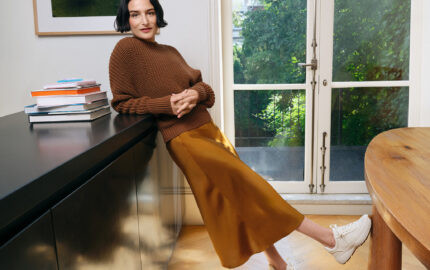 Jenny Slate wearing Cole Haan sneakers in the fall 2026 campaign.