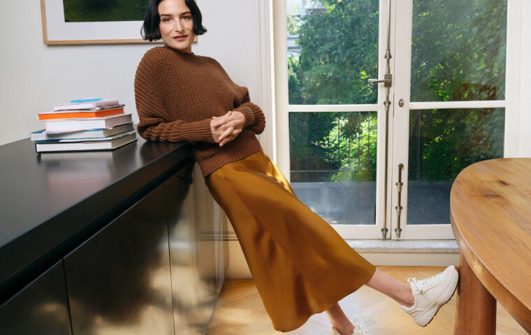 Jenny Slate wearing Cole Haan sneakers in the fall 2026 campaign.