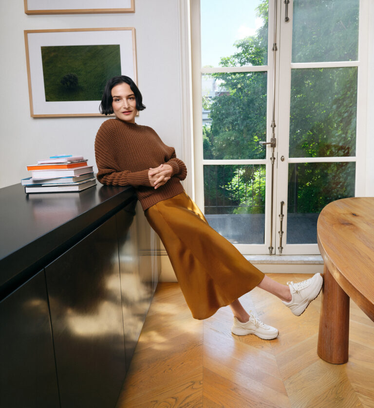 Jenny Slate wearing Cole Haan sneakers in the fall 2026 campaign.
