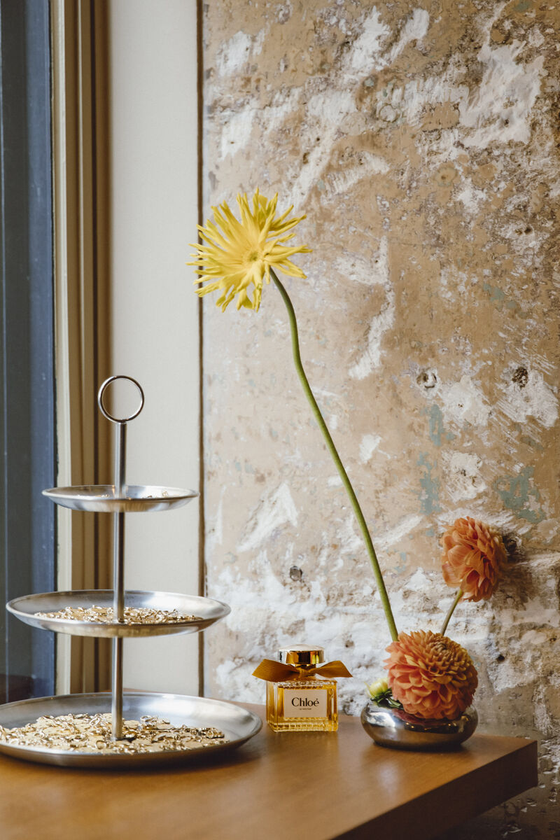Chloé Le Nectar fragrance displayed with flowers at the event