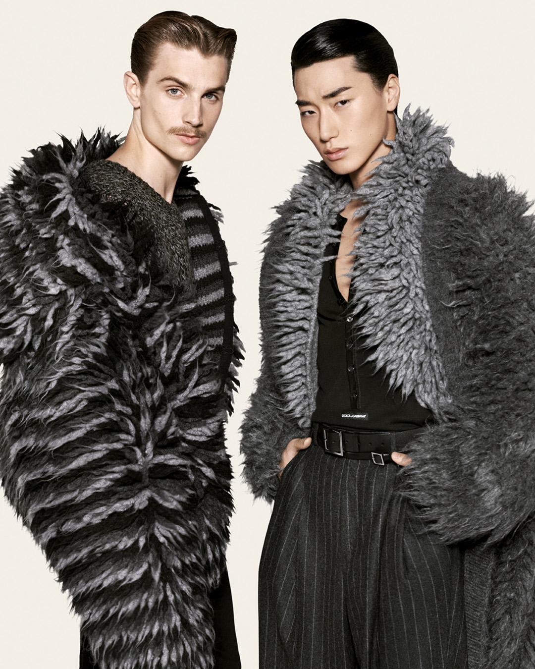 Two models in textured outerwear in Dolce & Gabbana’s Fall Winter 2026 men’s campaign