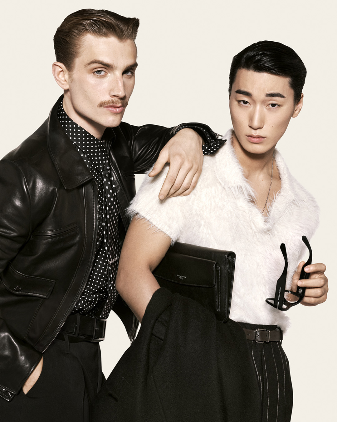 Two models in contrasting black and white campaign looks