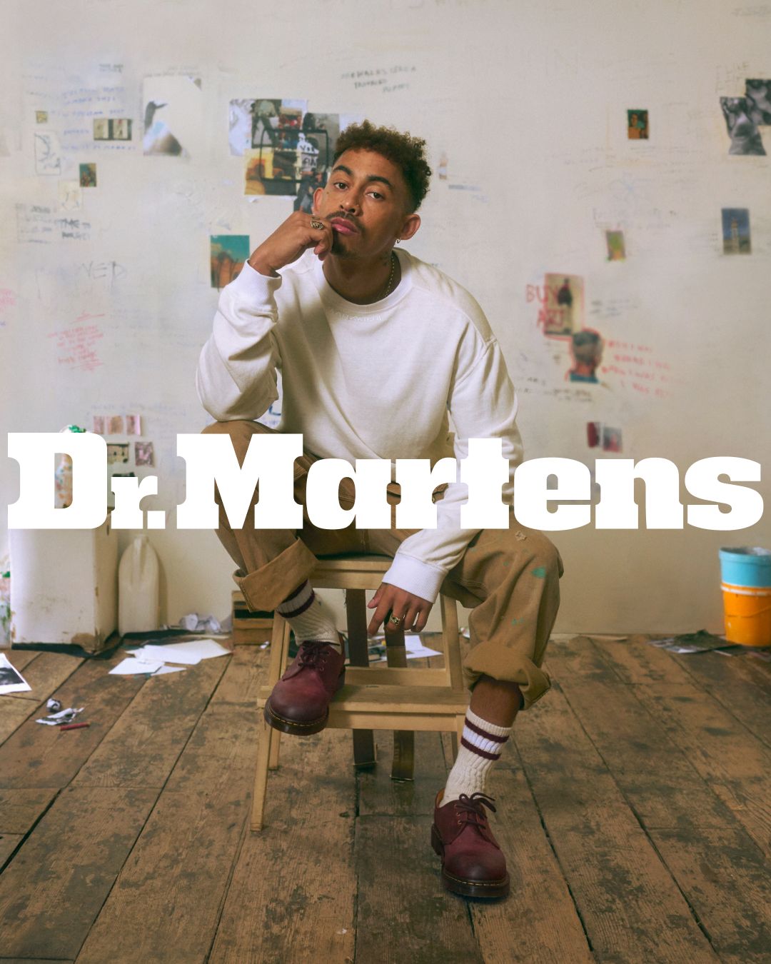Dr. Martens campaign portrait of a creative wearing burgundy shoes