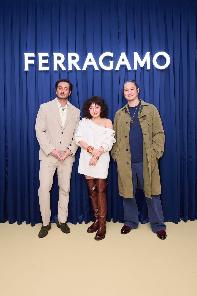 Guests in front of a Ferragamo backdrop at the LANDMARK boutique opening