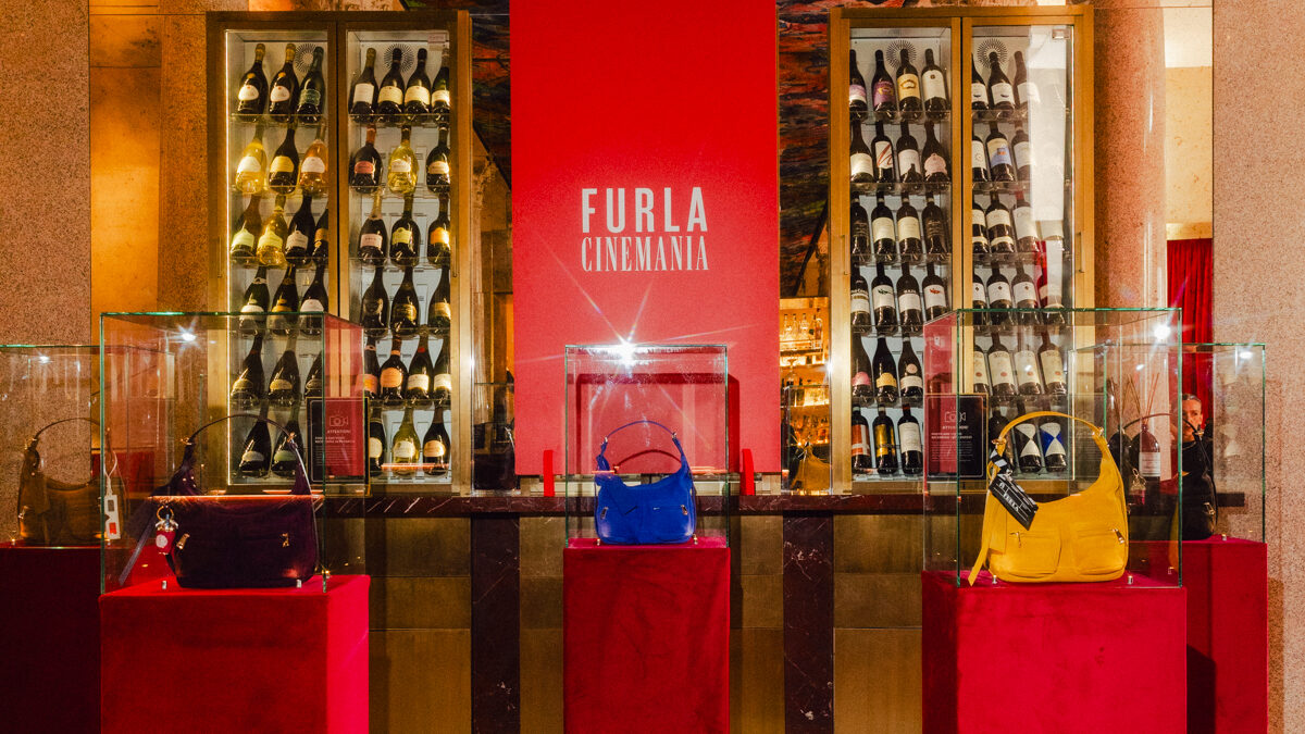 Furla Cinemania venue with Lynette bags displayed on red plinths
