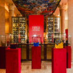 Furla Cinemania venue with Lynette bags displayed on red plinths