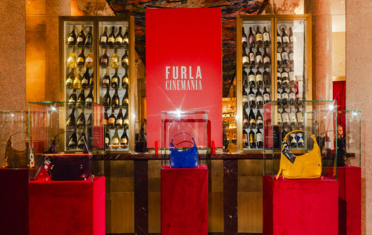 Furla Cinemania venue with Lynette bags displayed on red plinths