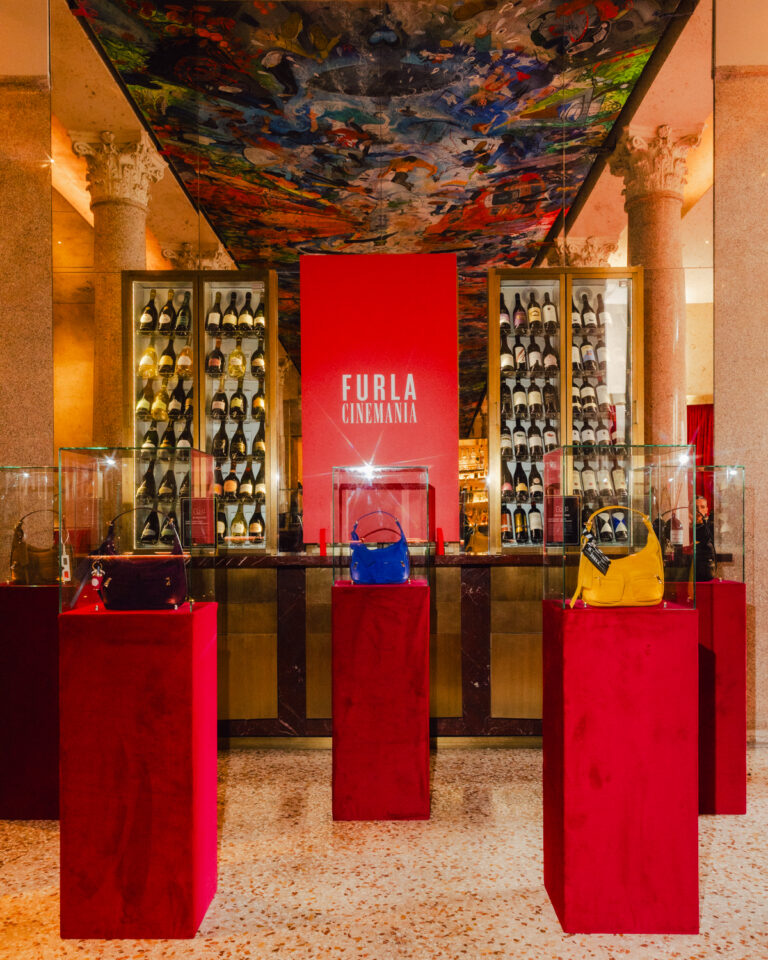 Furla Cinemania venue with Lynette bags displayed on red plinths