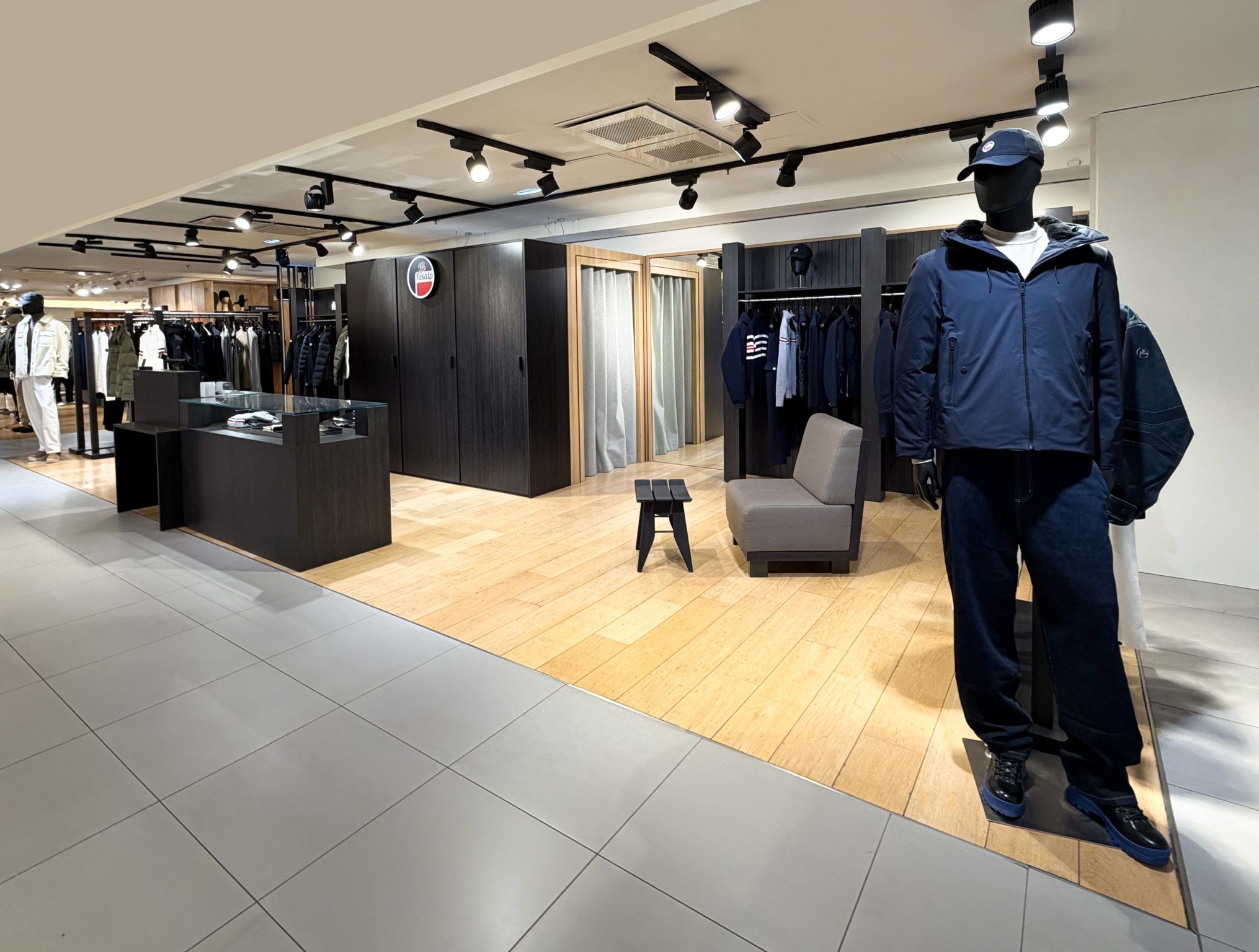 Wood fixtures and apparel in Fusalp’s Paris Haussmann store corner