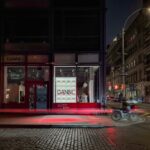 GANNI's illuminated Bou bag window at 40 Mercer Street in Soho at night