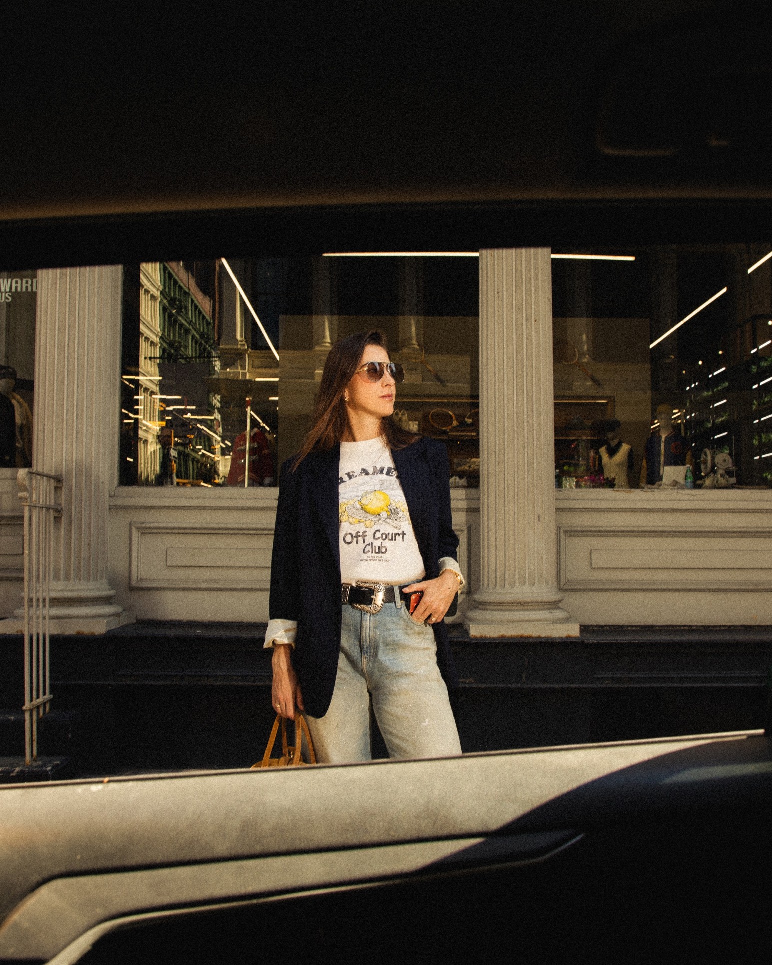 Belinda Bencic outside a storefront in Golden Goose’s off-court campaign