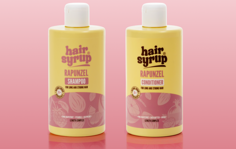 Hair Syrup Rapunzel shampoo and conditioner bottles against a pink background.