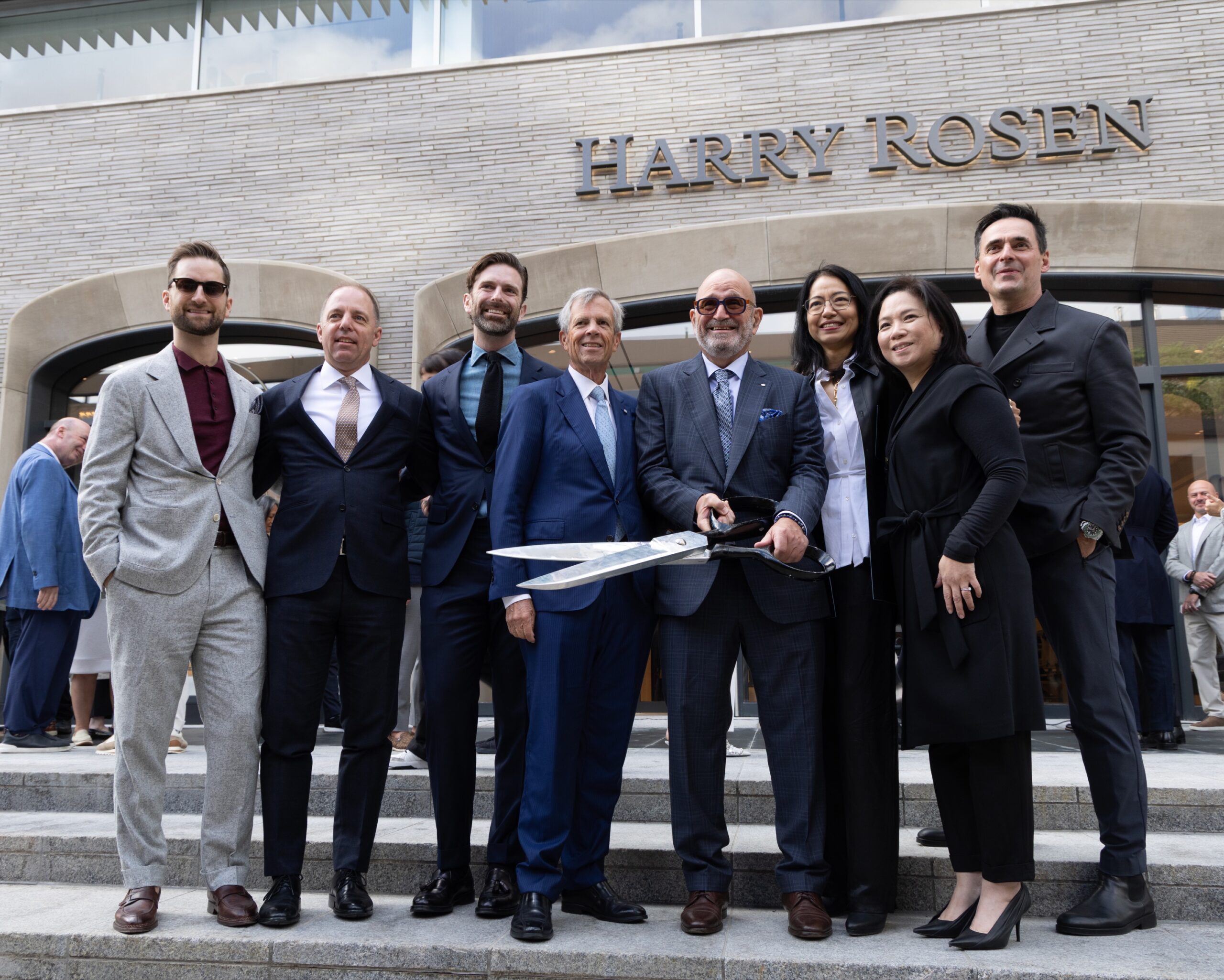 Group at the ribbon-cutting outside Harry Rosen's Cumberland Street flagship