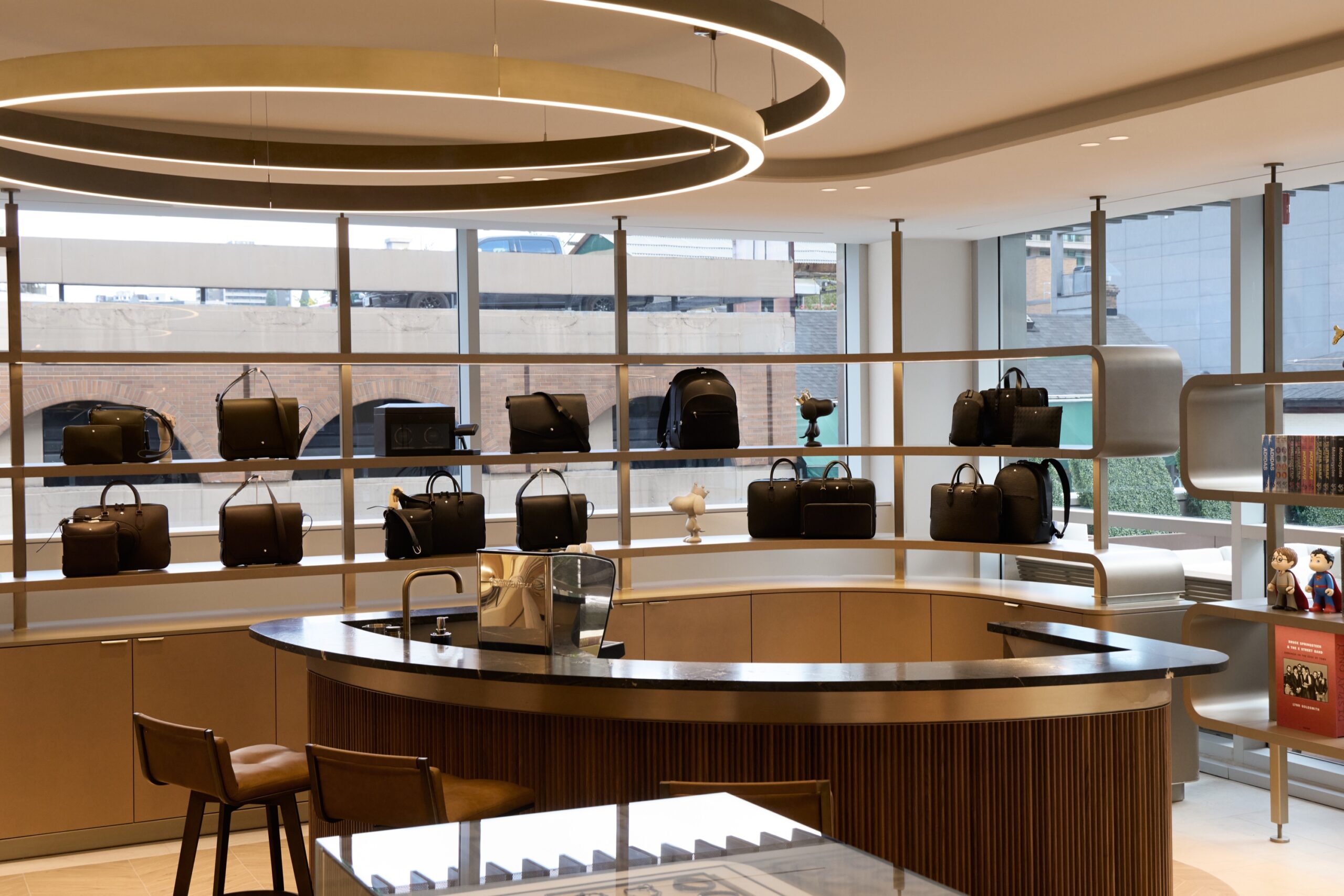 Accessories display and seating area inside Harry Rosen's Yorkville flagship
