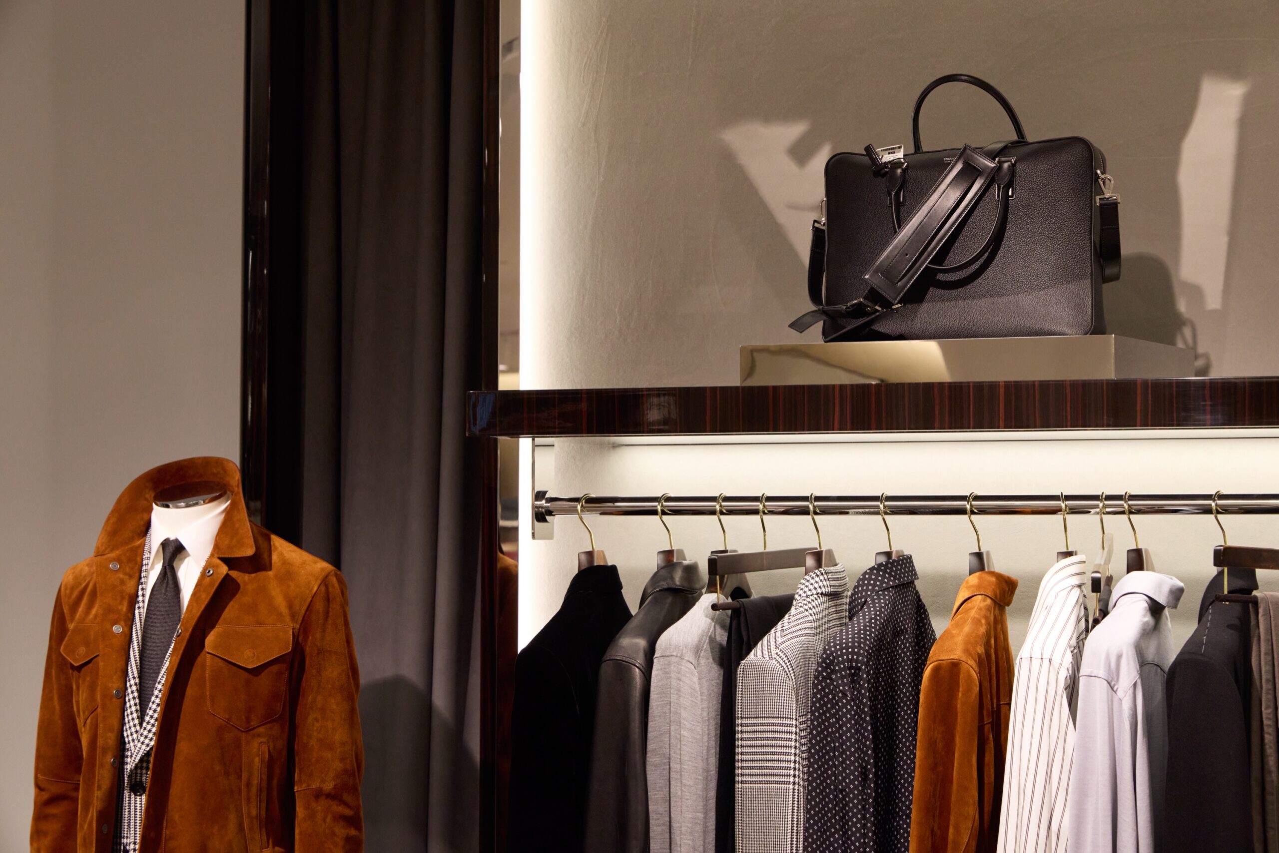 Outerwear and bag display inside the new Harry Rosen flagship