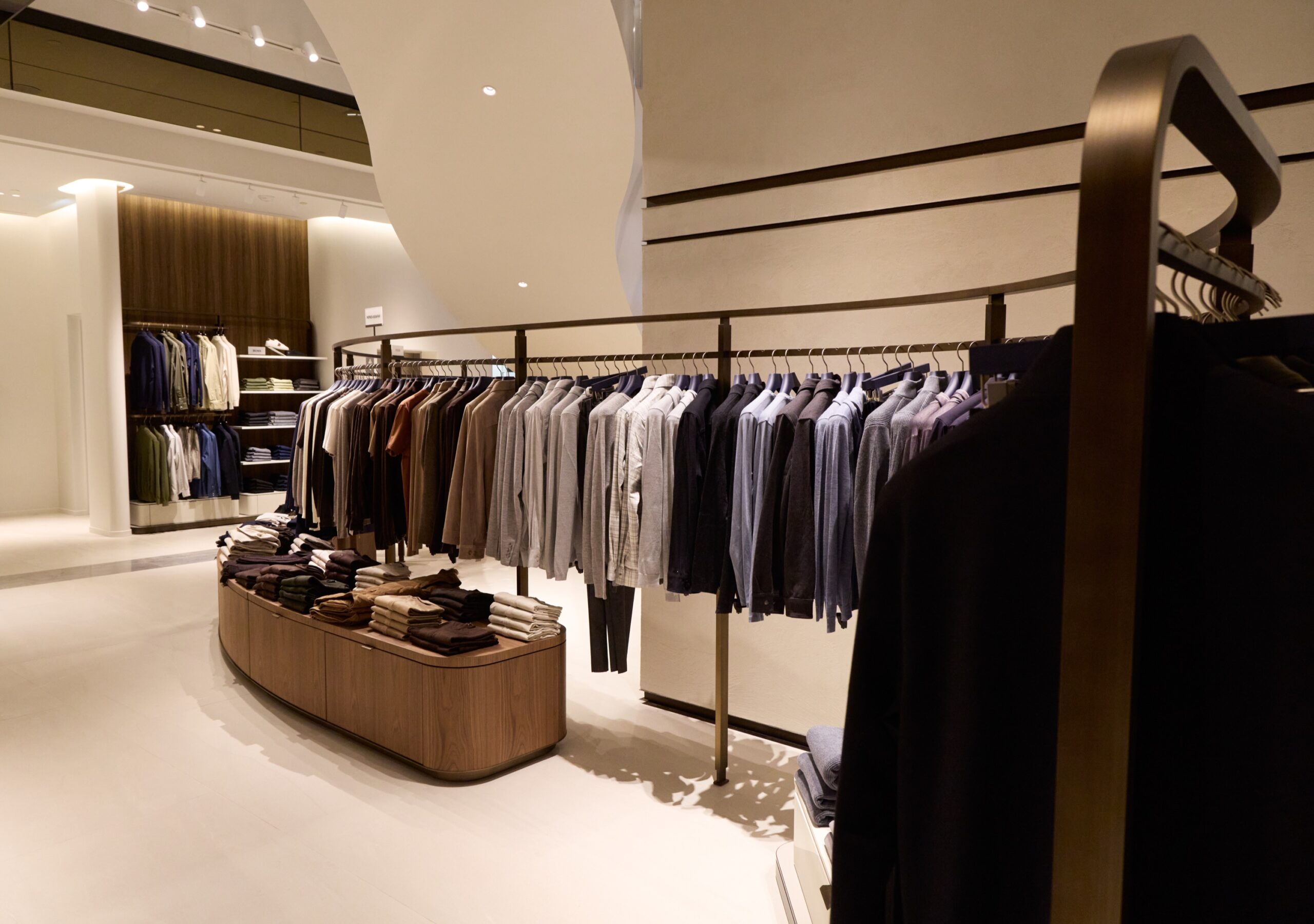 Menswear racks and tables inside Harry Rosen's three-level store