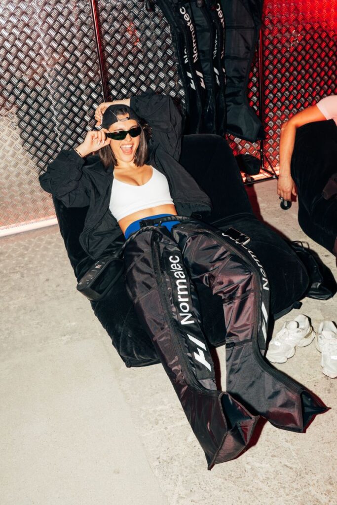 Attendee in a post-workout recovery area at the H&M Move event