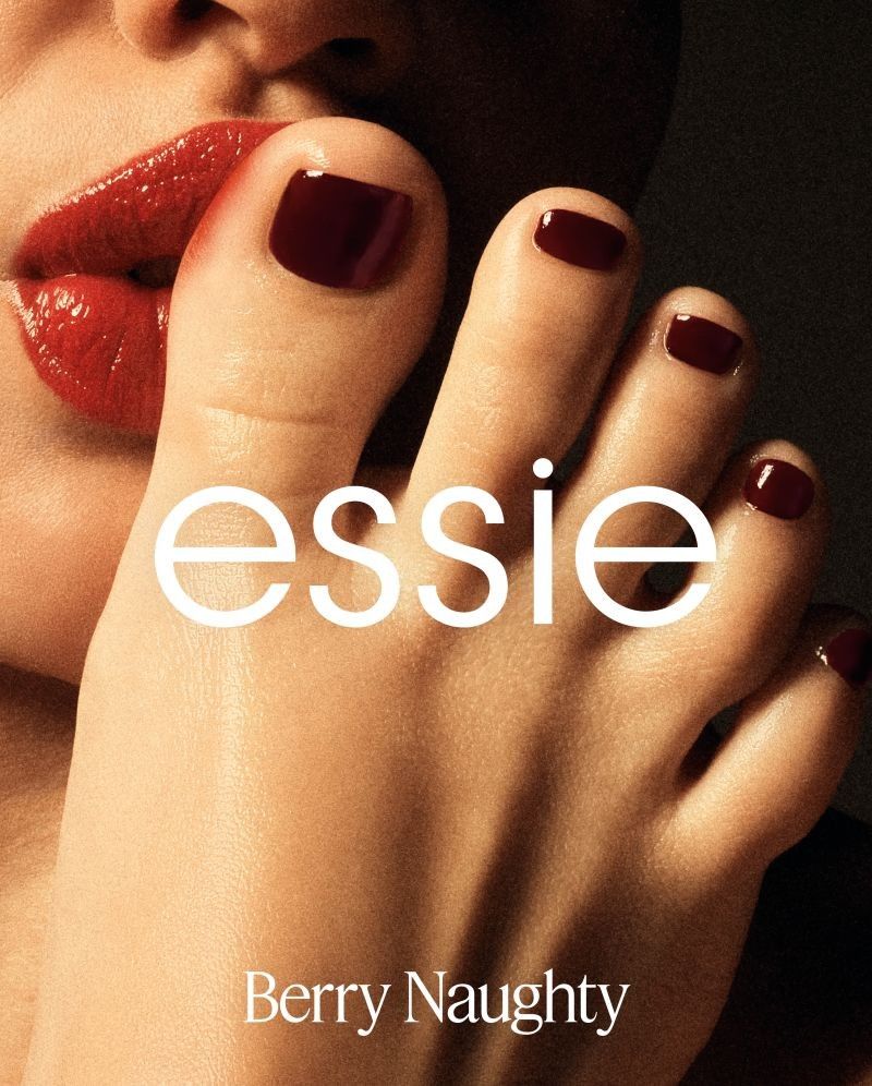 essie Berry Naughty campaign visual featuring a burgundy pedicure