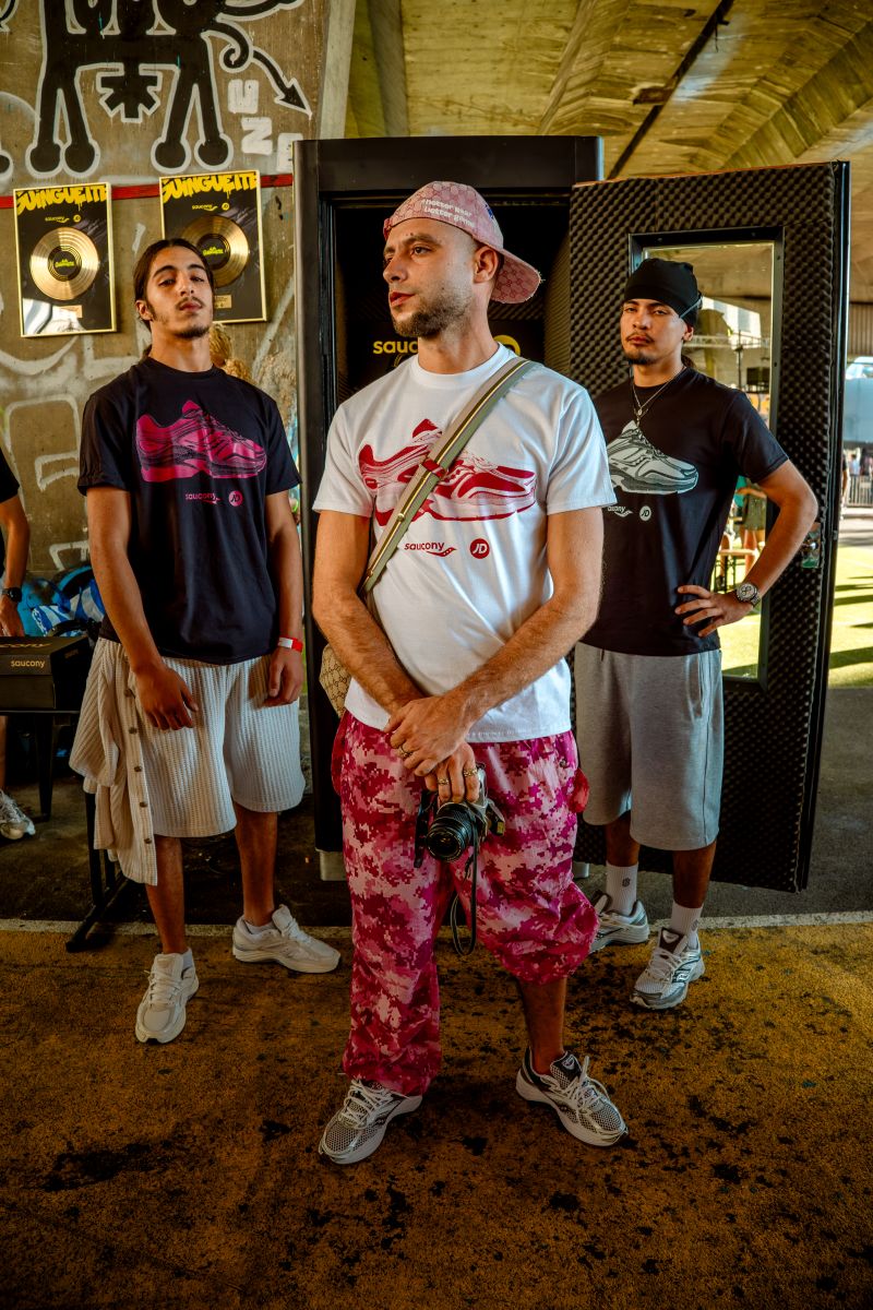 Guests wearing JD Sports and Saucony event shirts in Marseille